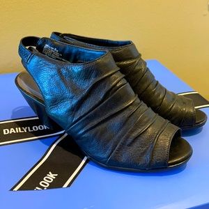 Black heels with toe peephole. Bare traps. Size 6.